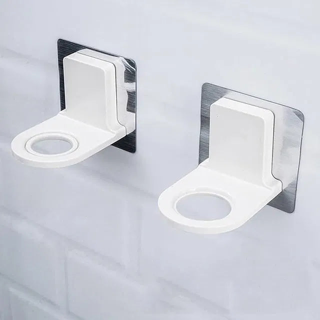 Pack of 2 Self Adhesive Shampoo Dispenser Bottle Racks, designed for bathroom, toilet, or kitchen; white plastic holders with circular openings, ideal for organizing bottles or cups on tiled walls.